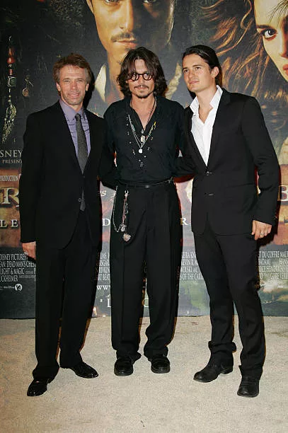 Jerry Bruckheimer, Johnny Depp and Orlando Bloom during "Pirates of The Caribbean: Dead Man's Chest" Paris Premiere at Gaumont Marignan Theater in...