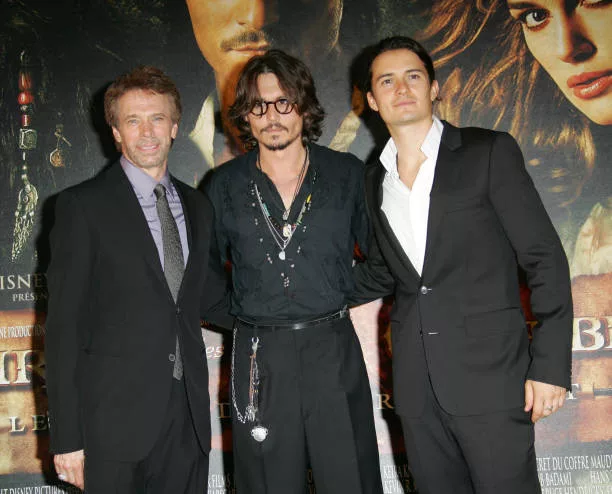 Jerry Bruckheimer, Johnny Depp and Orlando Bloom during "Pirates of The Caribbean: Dead Man's Chest" Paris Premiere at Gaumont Marignan Theater in...