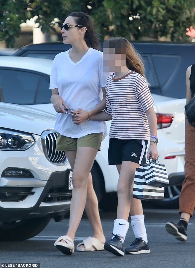 Gal Gadot shows off her long legs in casual shorts as she takes her daughters out for frozen yogurt